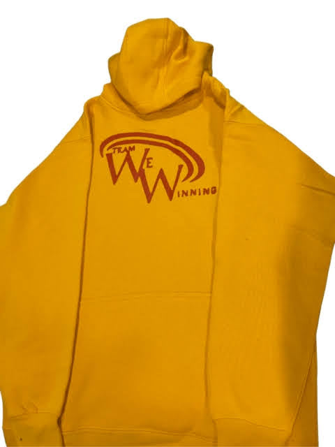 Yellow hoodie with Team We Winning red logo on a white background