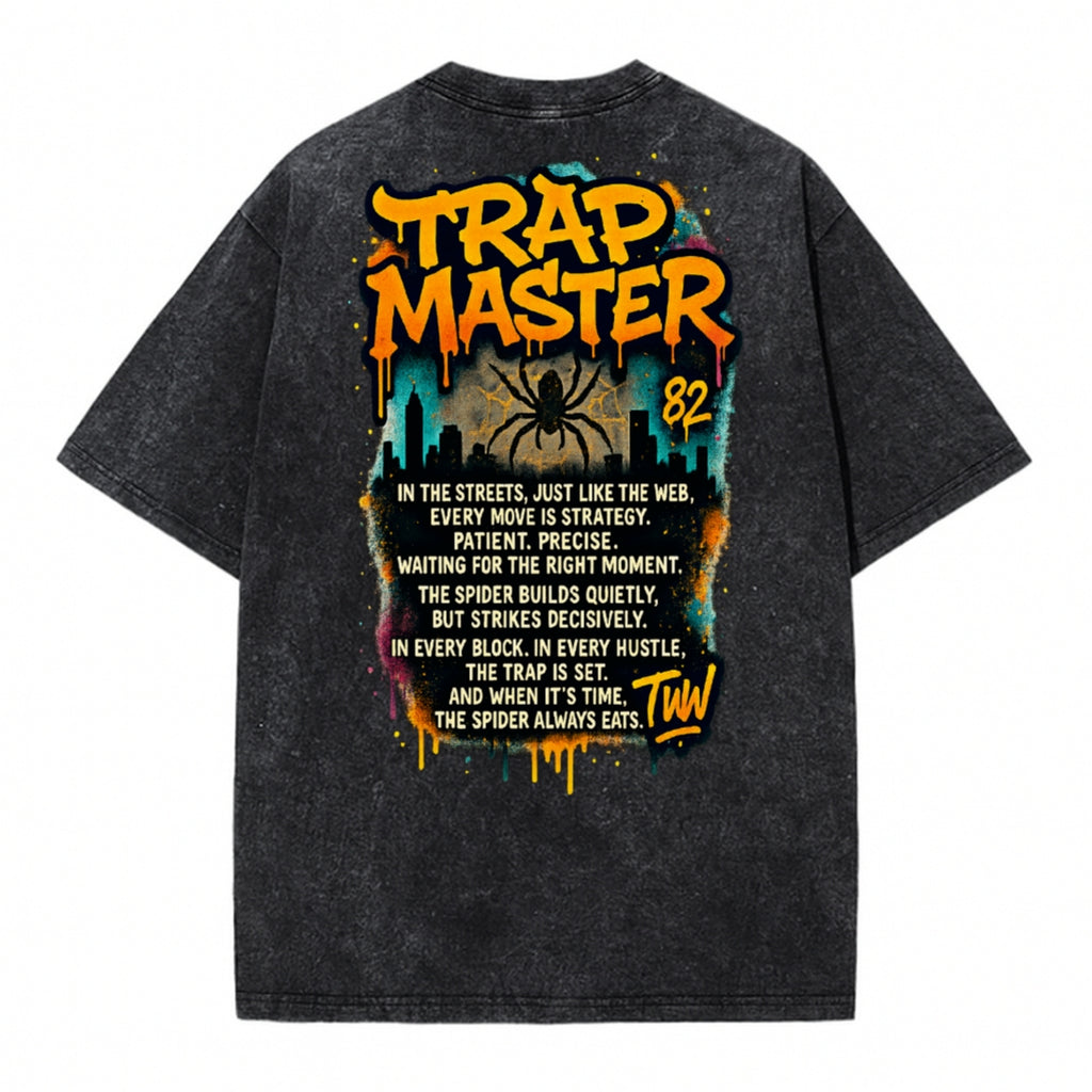 Black T-shirt back with colorful 'Trap Master' graphic and text design, featuring a spider and city skyline, on a white background